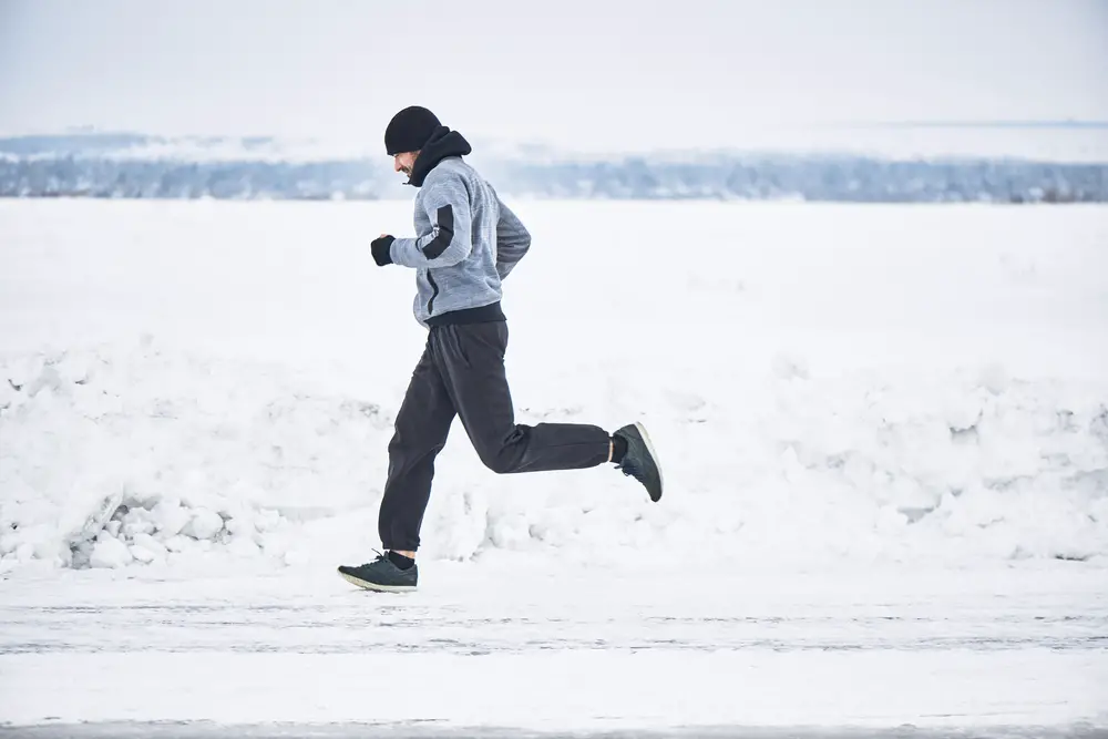 The,Athlete,Runs,In,The,Winter,On,The,Road